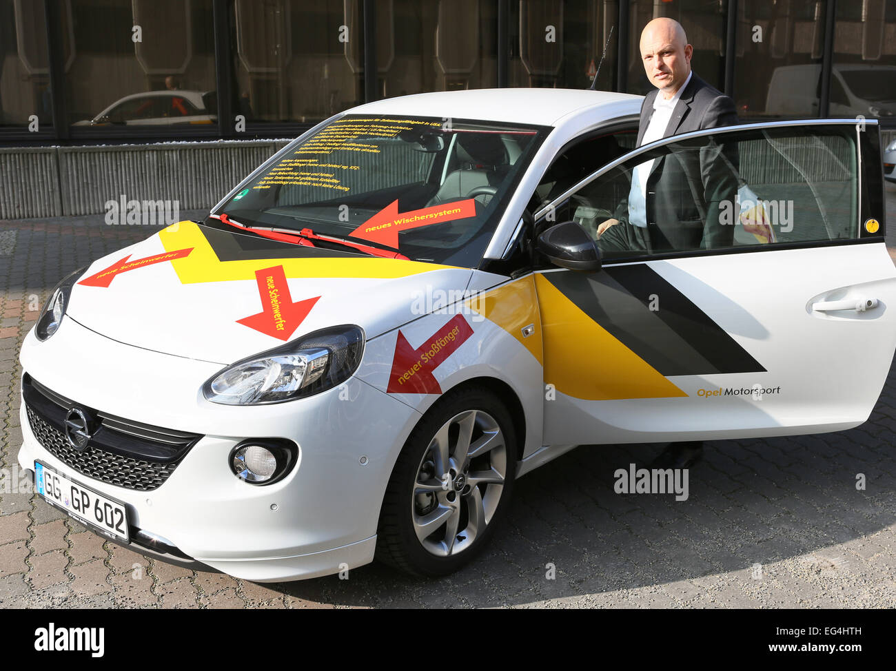 Berlin, Germany. 13th Feb, 2015. Jan Burdinski, director of the Opel  representative office in Berlin, gets into an Opel Adam show car, which has  been designed following the standards of the Transatlantic