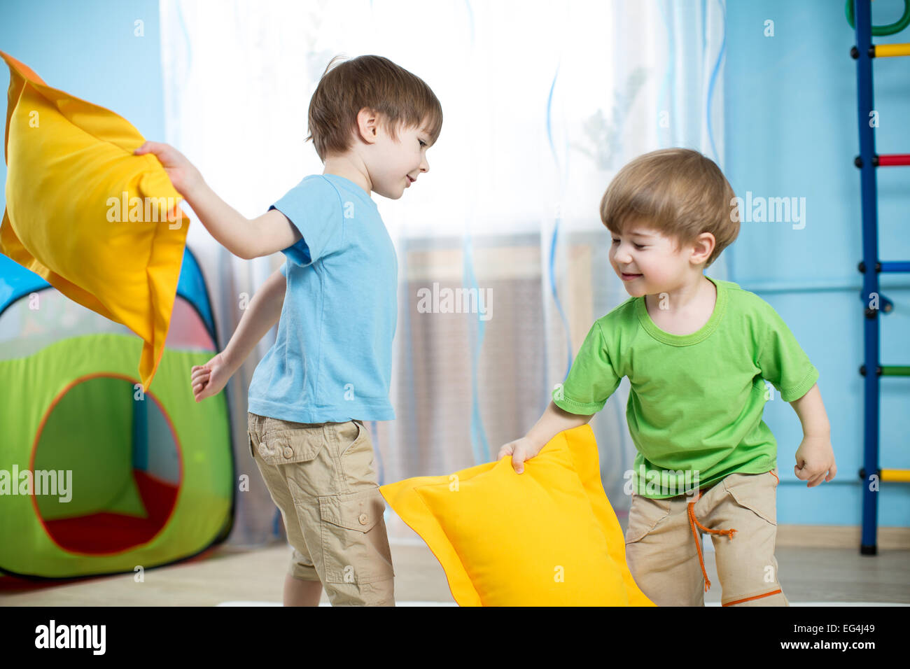 kids boys  playing with pillows Stock Photo