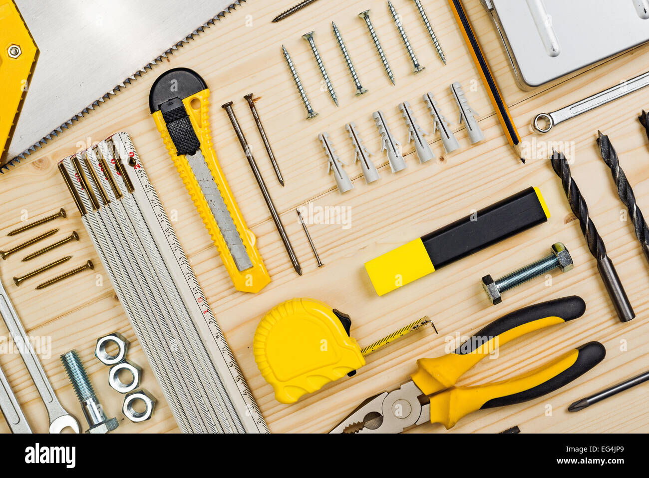 Assorted Woodwork and Carpentry or Construction Tools on Pine Wood Texture Background. Stock Photo