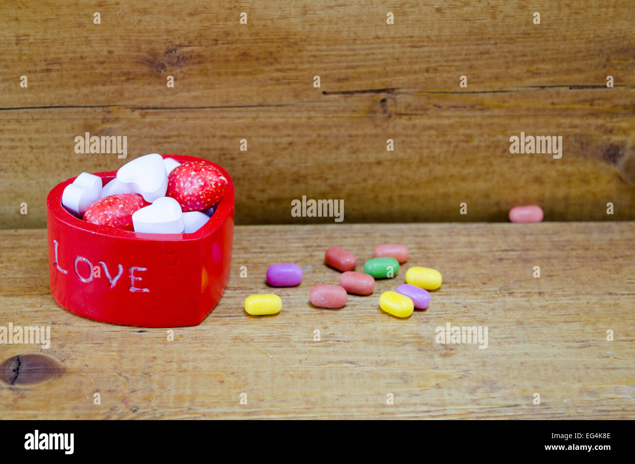 Hear shaped box filled with colorful candies Stock Photo