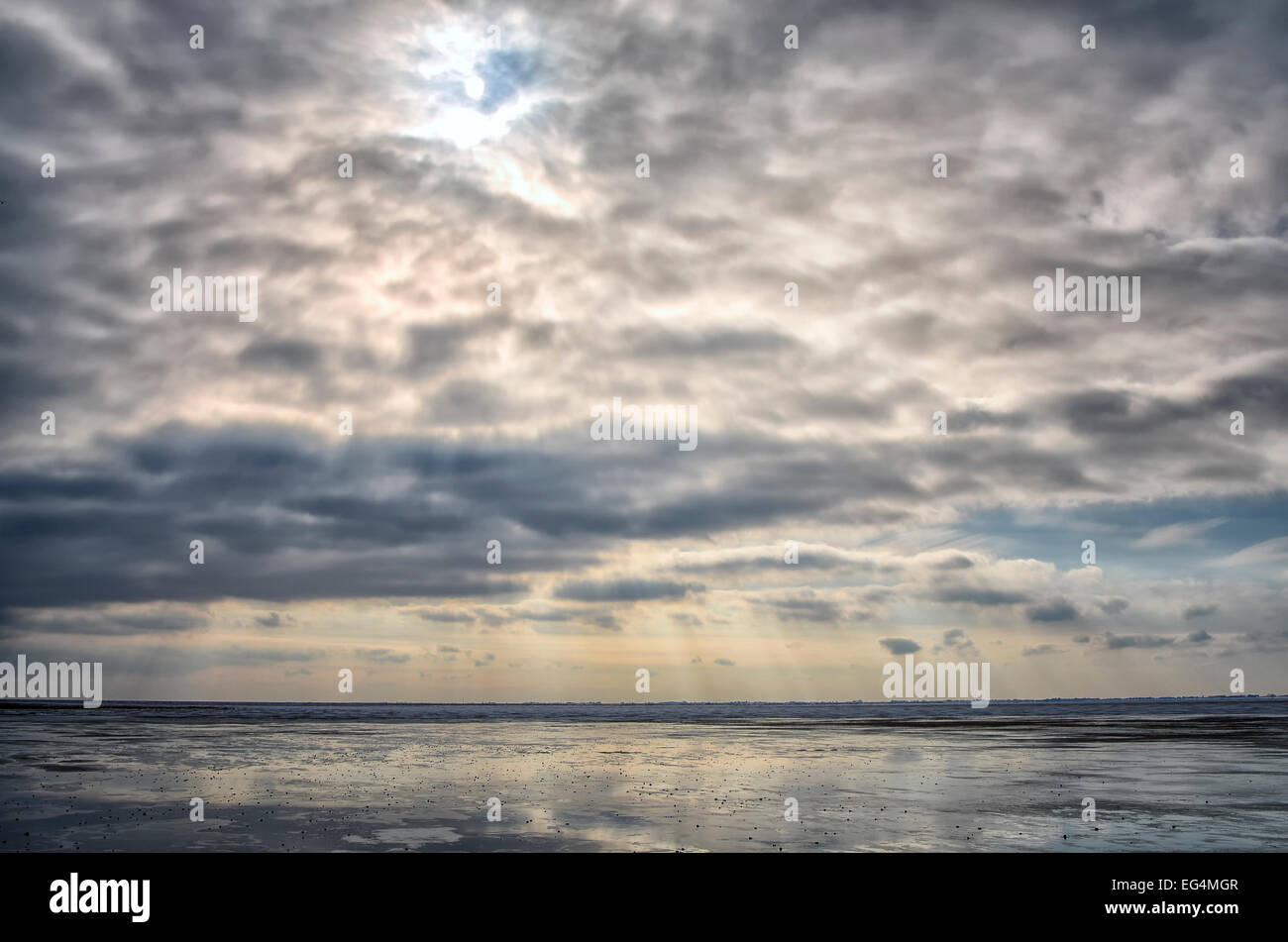 Clouds with sunshine on a winter's day at sea Stock Photo