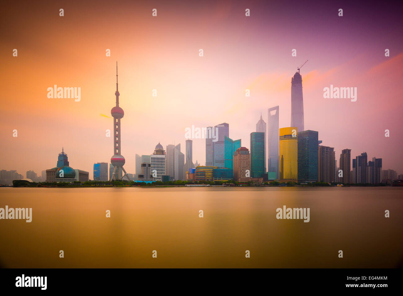 Shanghai, China cityscape viewed across the Huangpu River at dawn. Stock Photo