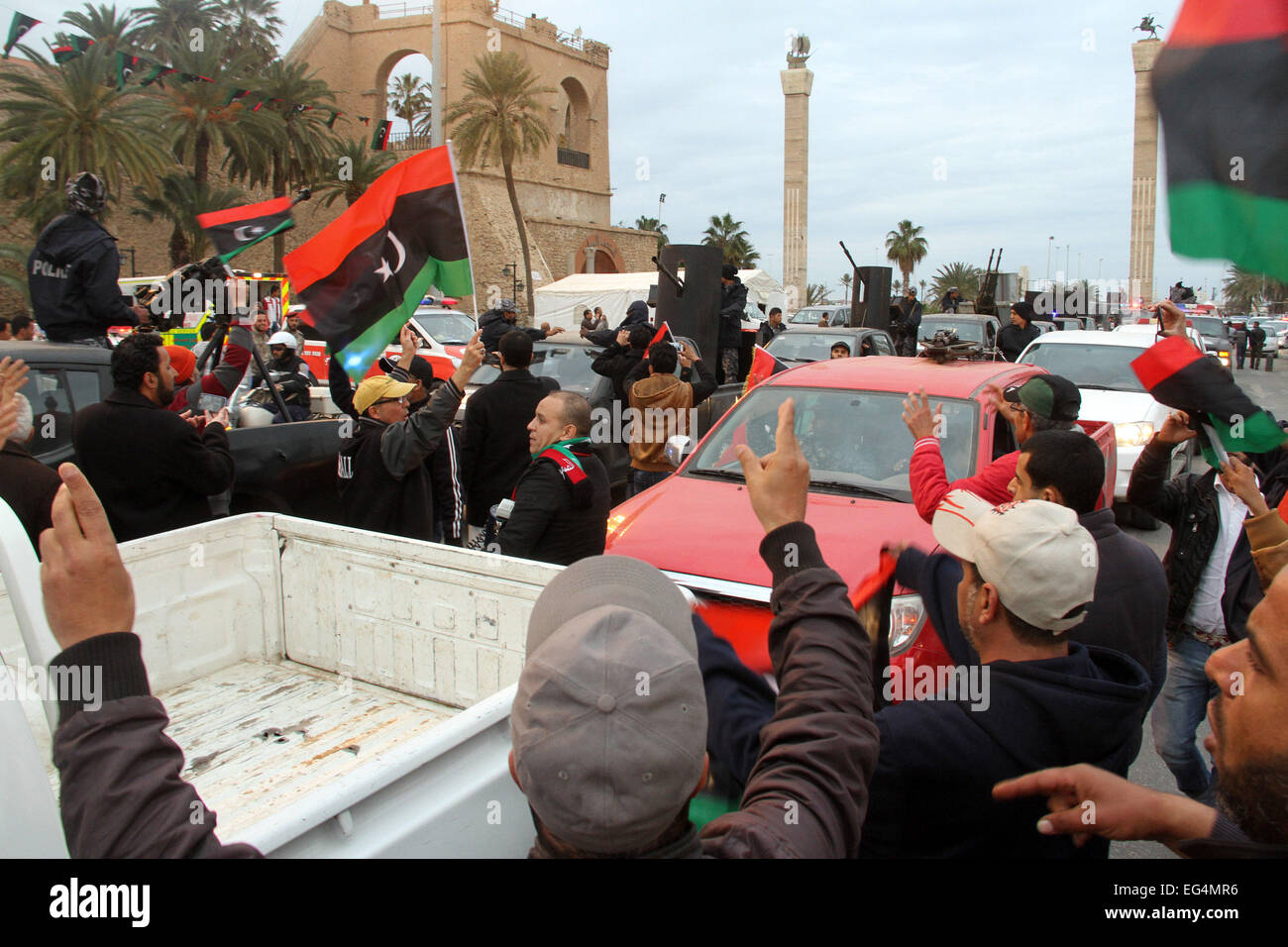 Tripoli, Libya. 16th February, 2015. Tripoli's policemen and troops drive their armed vehicles passing Martyrs Square in Tripoli, Libya, on Feb. 16, 2015. Police and army forces paraded on Monday in Tripoli to mark the fourth anniversary of the uprising against the former Libyan leader Muammar Gaddafi. Credit:  Xinhua/Alamy Live News Stock Photo