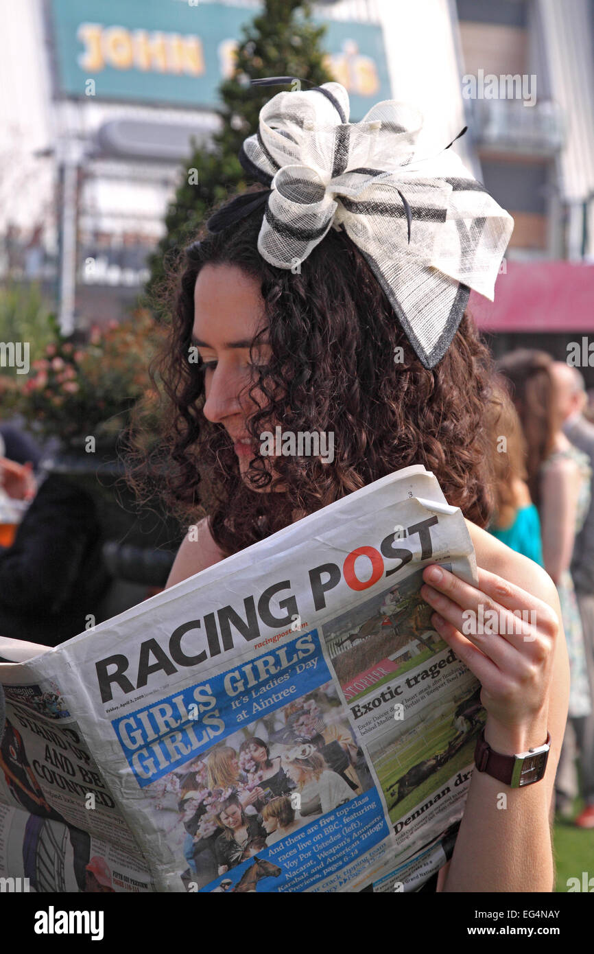 Studying form on Ladies Day / Grand National meeting / Aintree Racecourse / Liverpool / Merseyside / UK Stock Photo