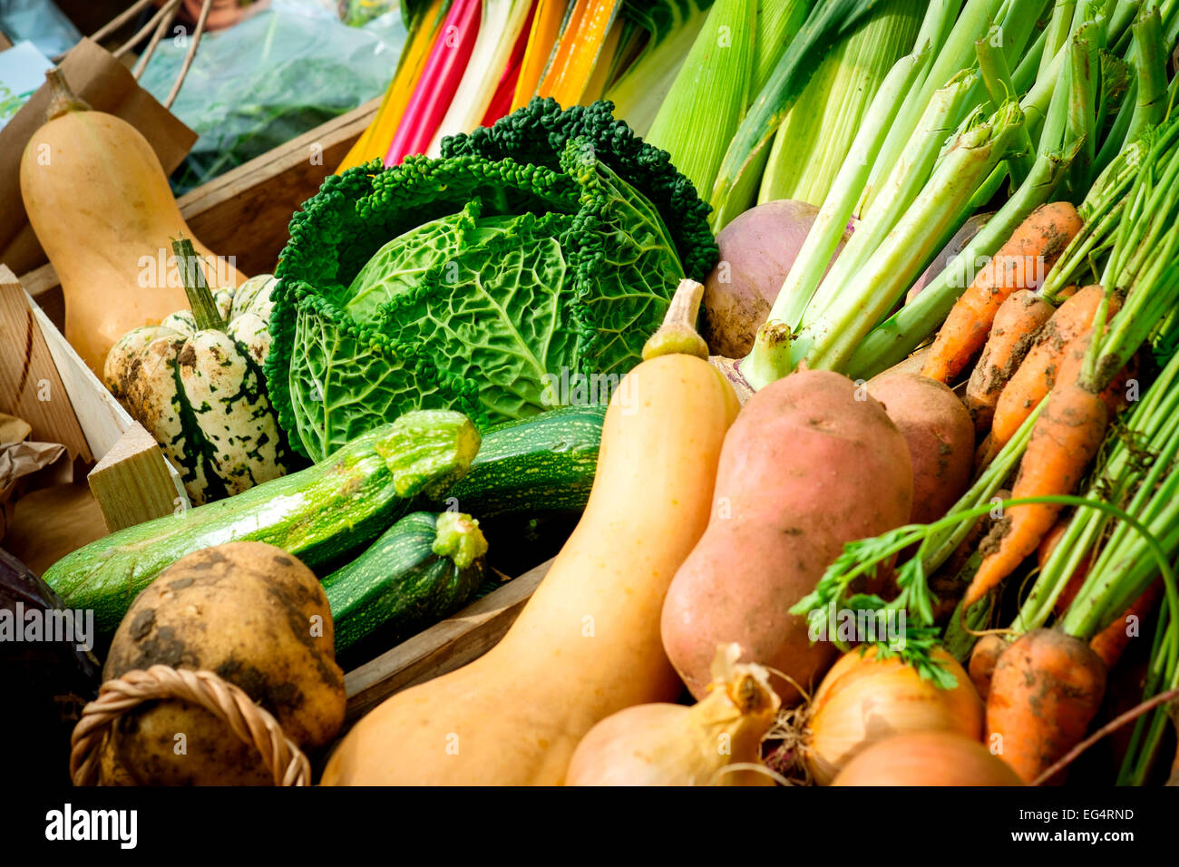 Variety of local fresh vegetables on farmers market stall, Isles of Scilly, UK Stock Photo