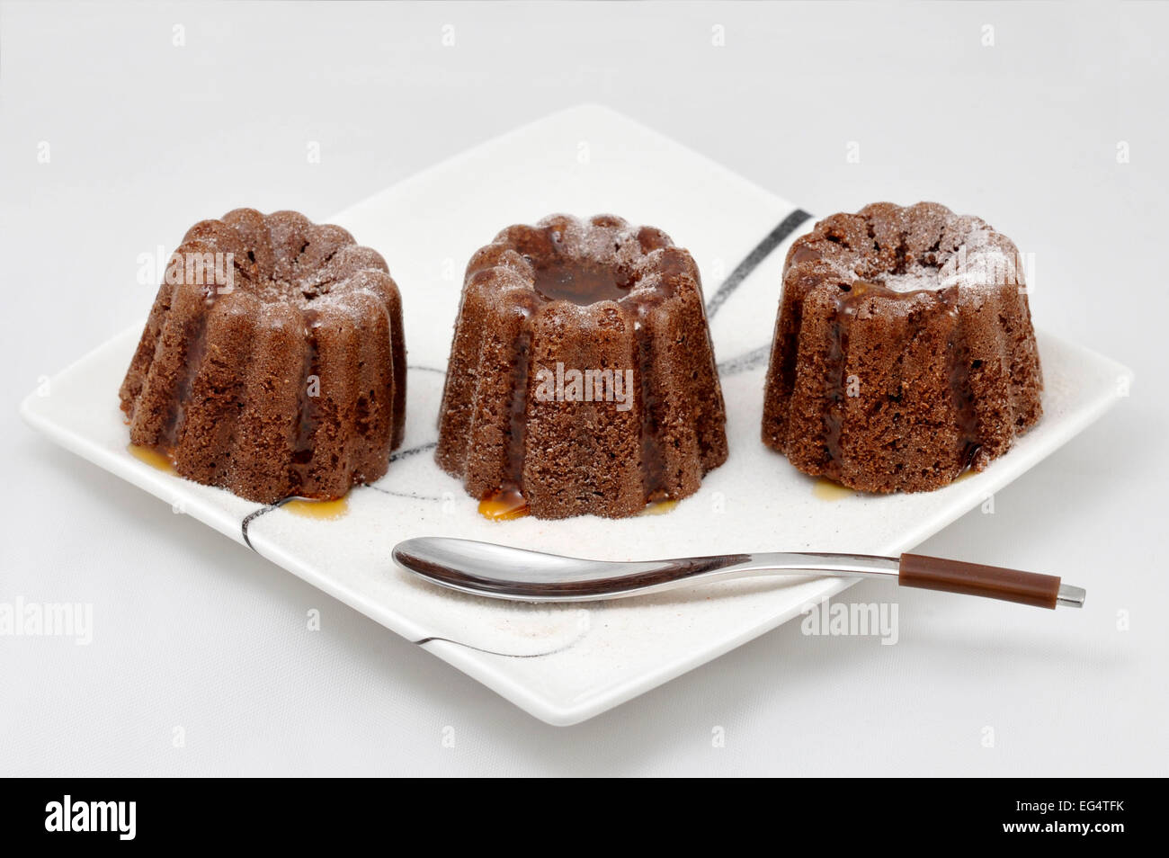 Miniature bundt cakes decorated with maple syrup Stock Photo Alamy