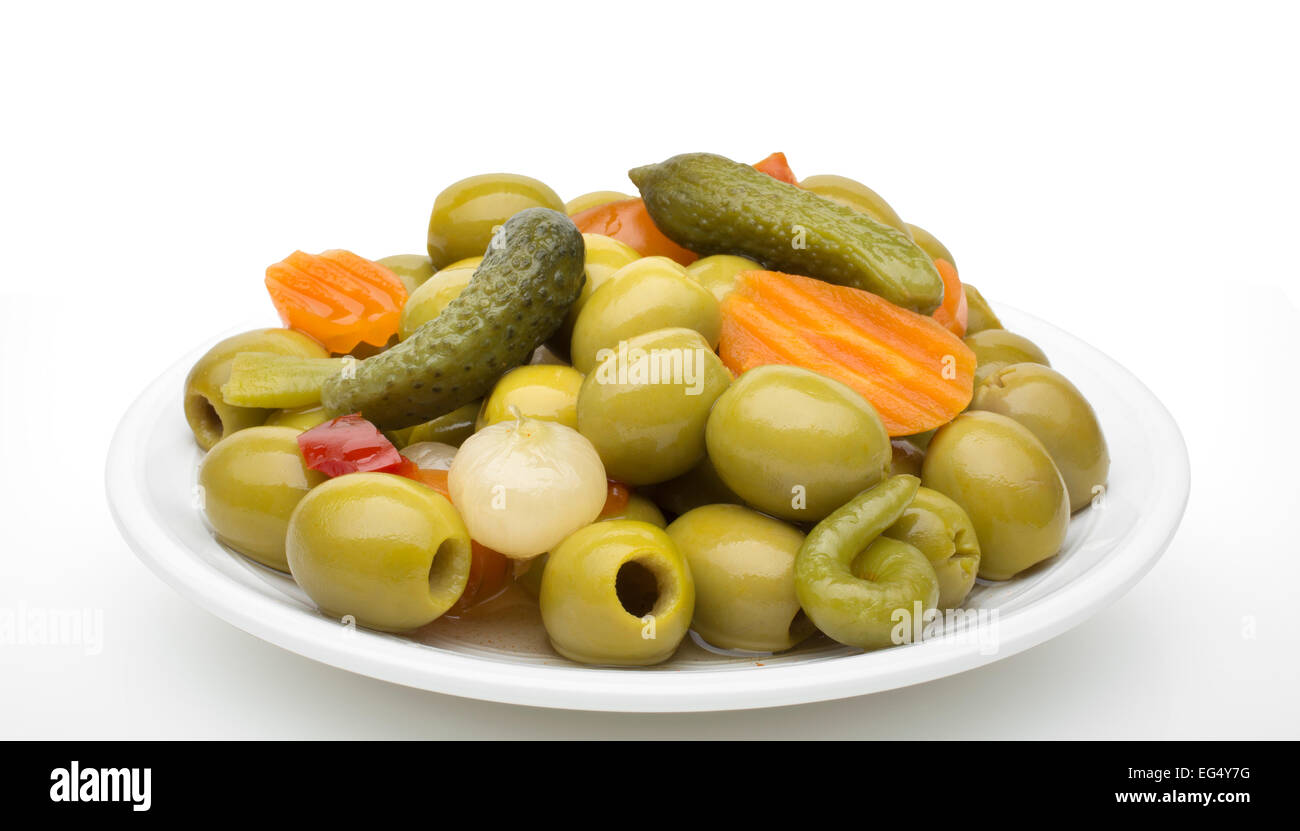 Pickled gherkins olives onions carrots garlic red pepper chili Stock Photo