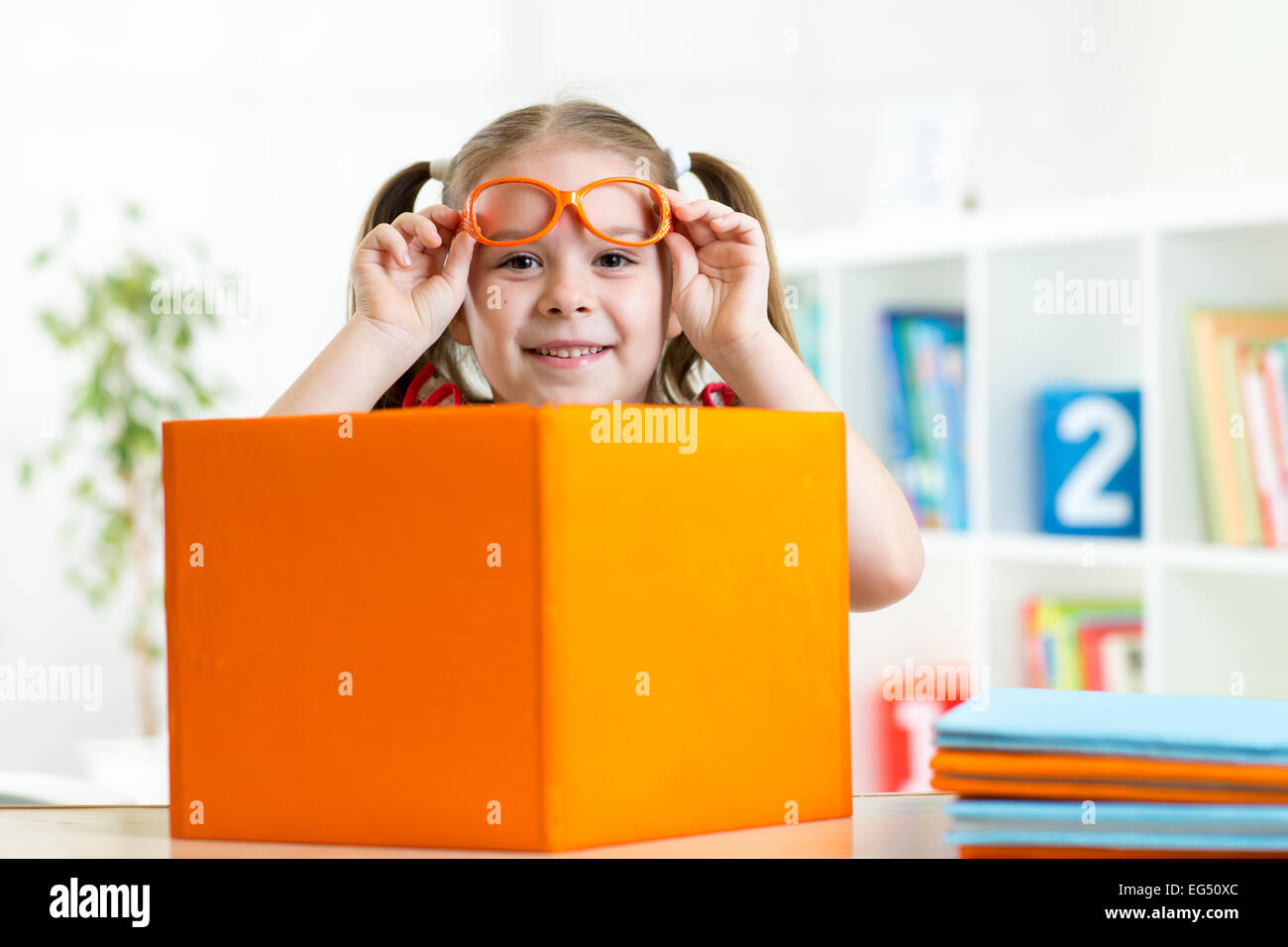 happy smiling kid girl with books, education concept Stock Photo - Alamy