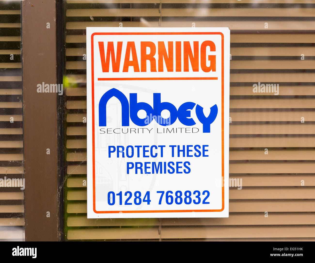 security company sign on building Stock Photo Alamy
