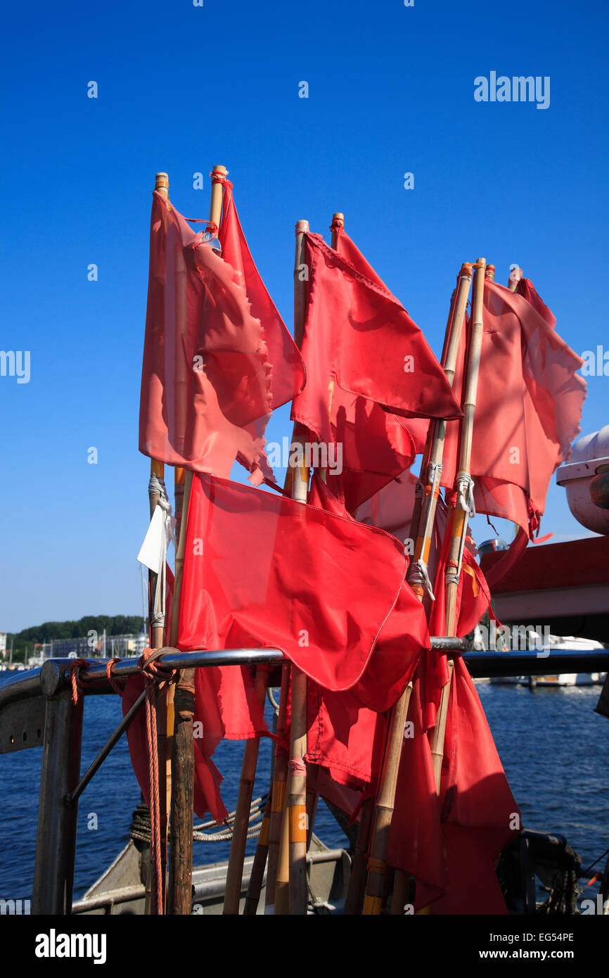 Red flags on a fishing boat, Travemuende harbolur, baltic Sea coast,  Schleswig-Holstein, Germany, Europe Stock Photo