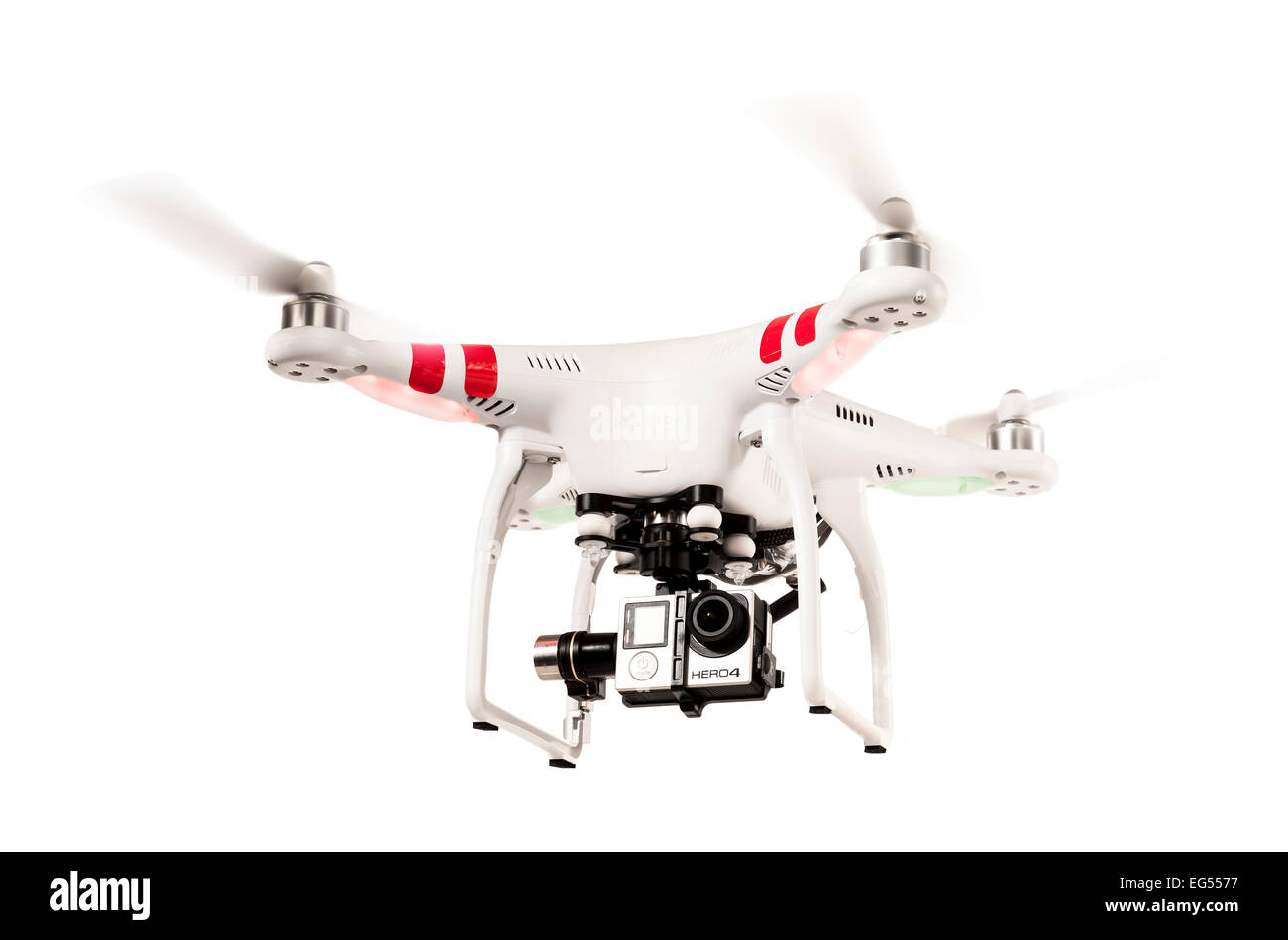 A DJI phantom quadcopter or drone flying on a white background Stock Photo