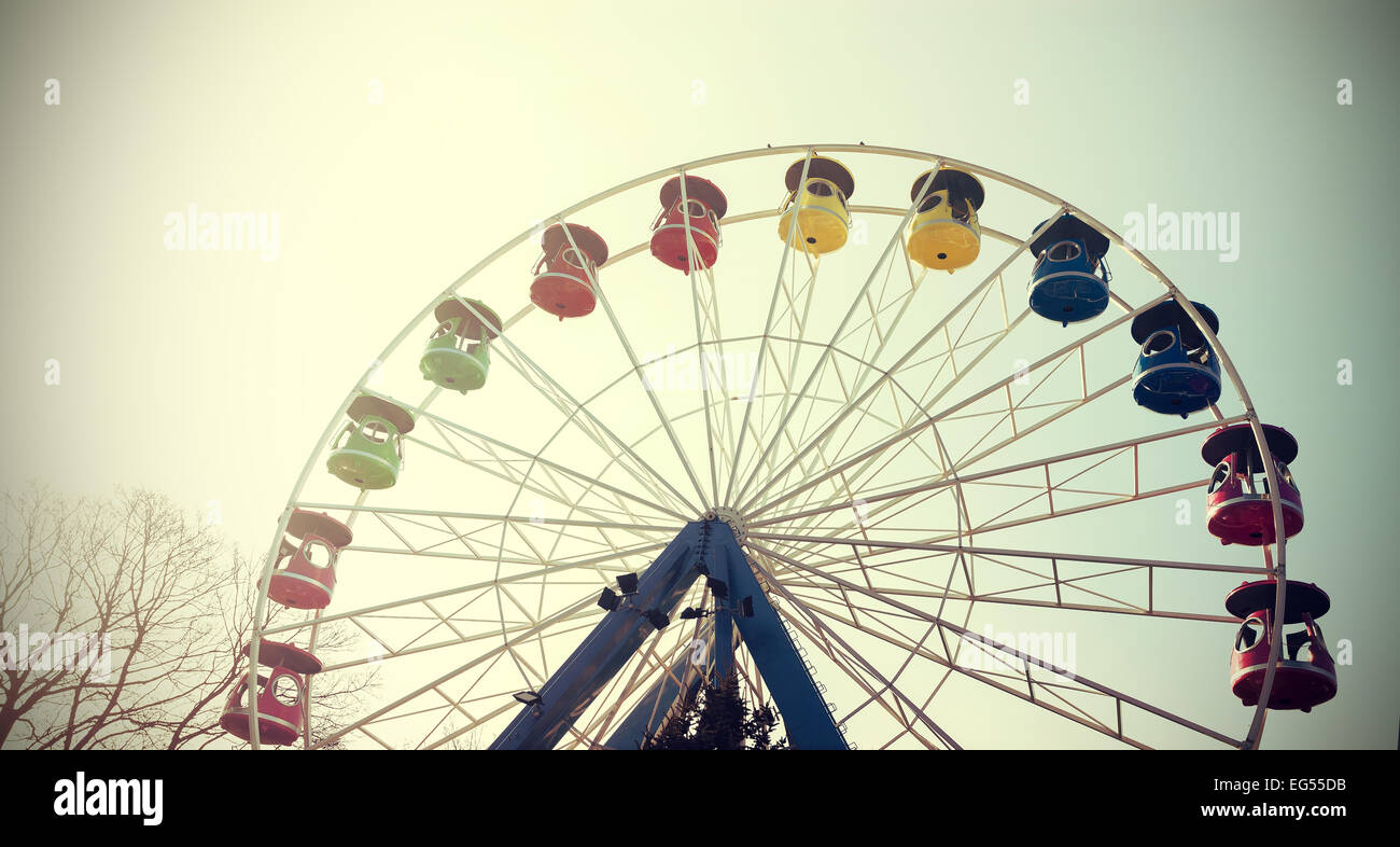 Retro vintage filtered picture of a ferris wheel. Stock Photo