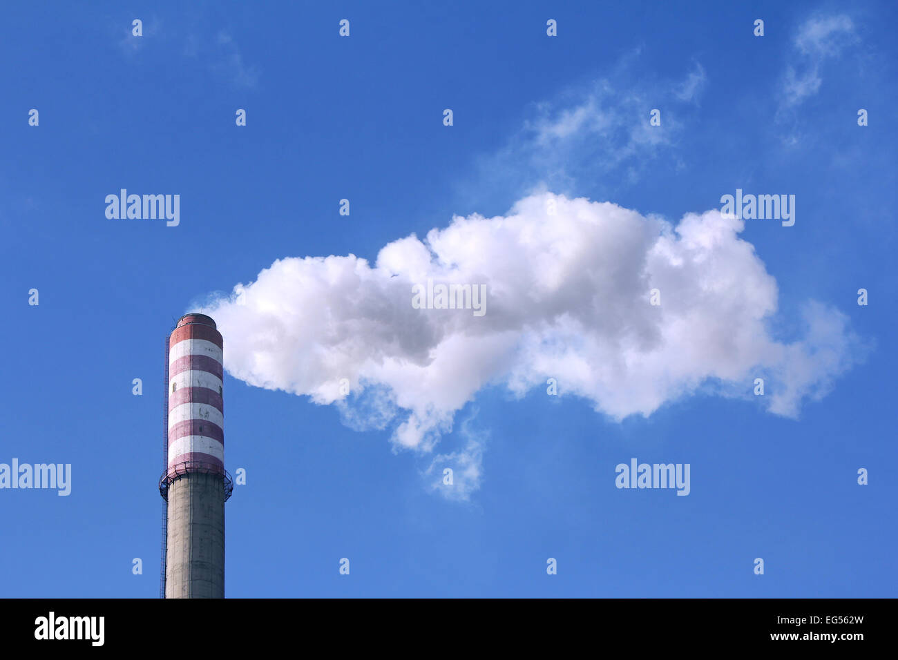 White smoke clouds from a high heating plant chimney Stock Photo