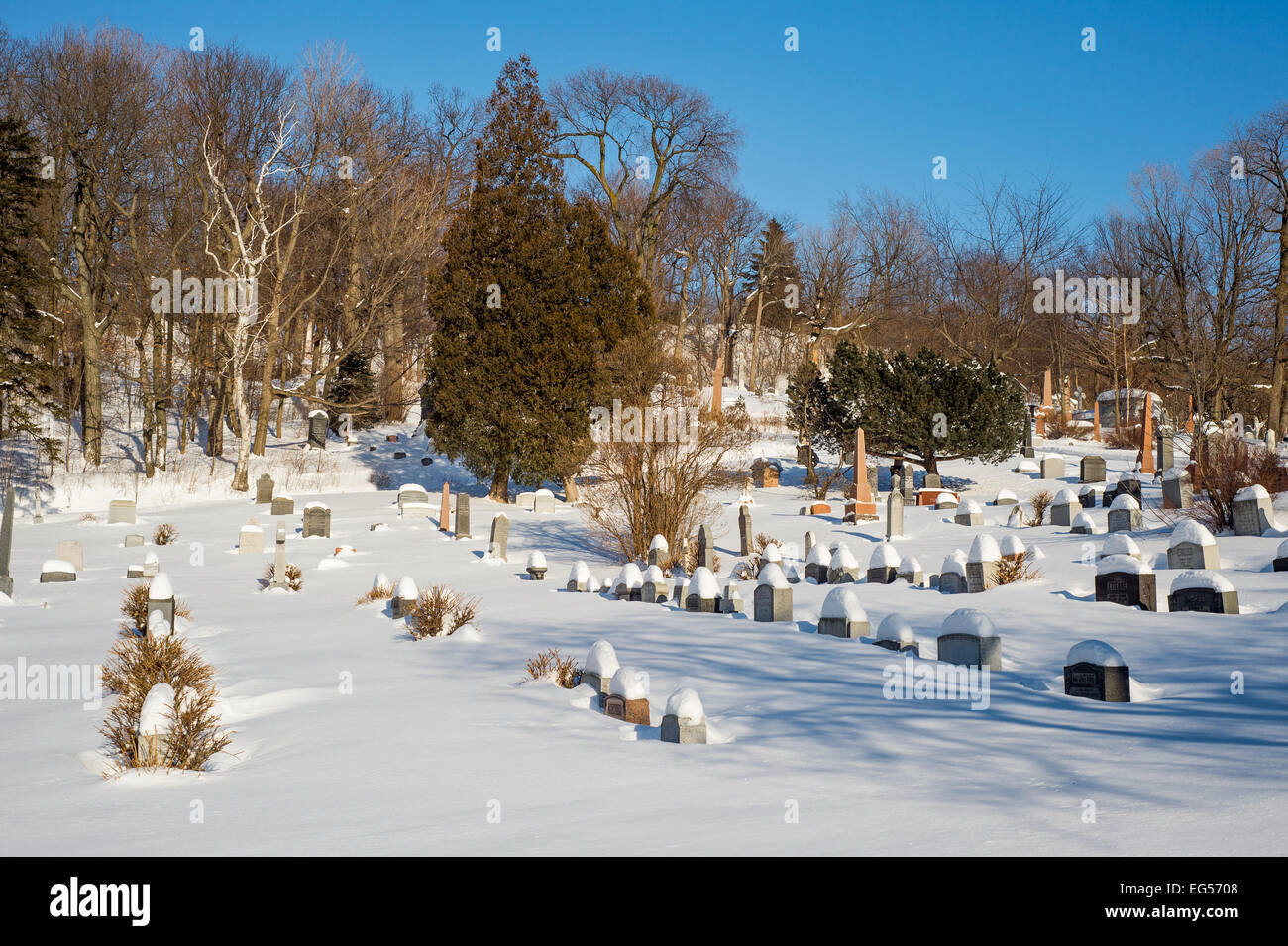 Tombstones covered by snow in an American cemetery Stock Photo