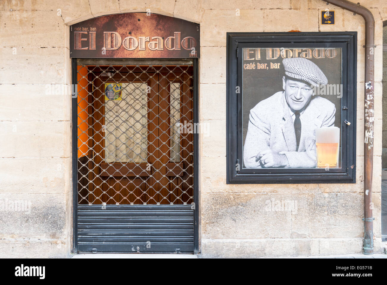 The El Dorado cafe and bar in Legrono Spain with a picture of John Wayne on the advertising poster on the wall outside Stock Photo