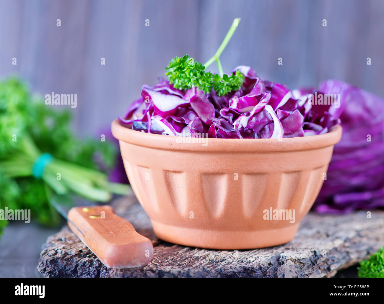 blue cabbage in bowl and on a table Stock Photo Alamy