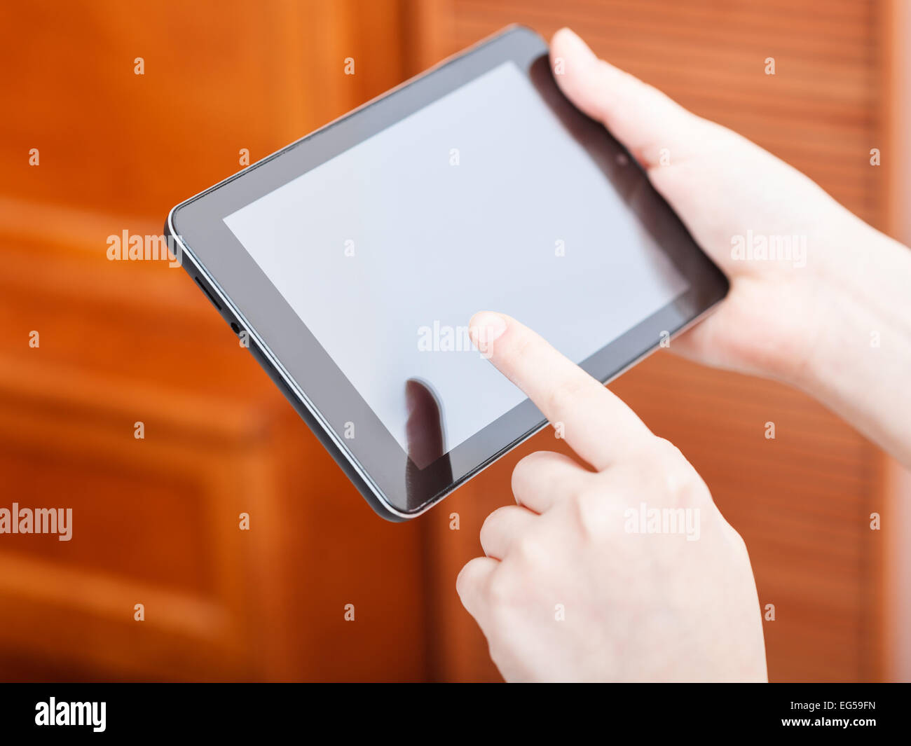 finger clicking tablet pc screen in office Stock Photo Alamy