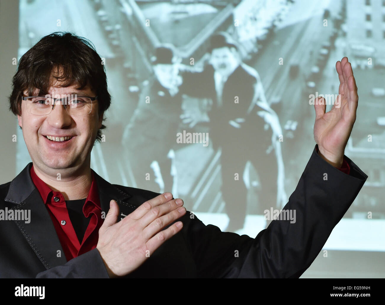 Berlin, Germany. 24th Jan, 2015. dpa-EXCLUSIVE - Pianist Carsten-Stephan Graf von Bothmer stands in front of screen which displays the Silent film comedians Stan Laurel and Oliver Hardy at the 'Passionskirche' church in Berlin, Germany, 24 January 2015. Pianist Graf von Bothmer performs live music as part of a series of silent films. Photo: Jens Kalaene/dpa/Alamy Live News Stock Photo