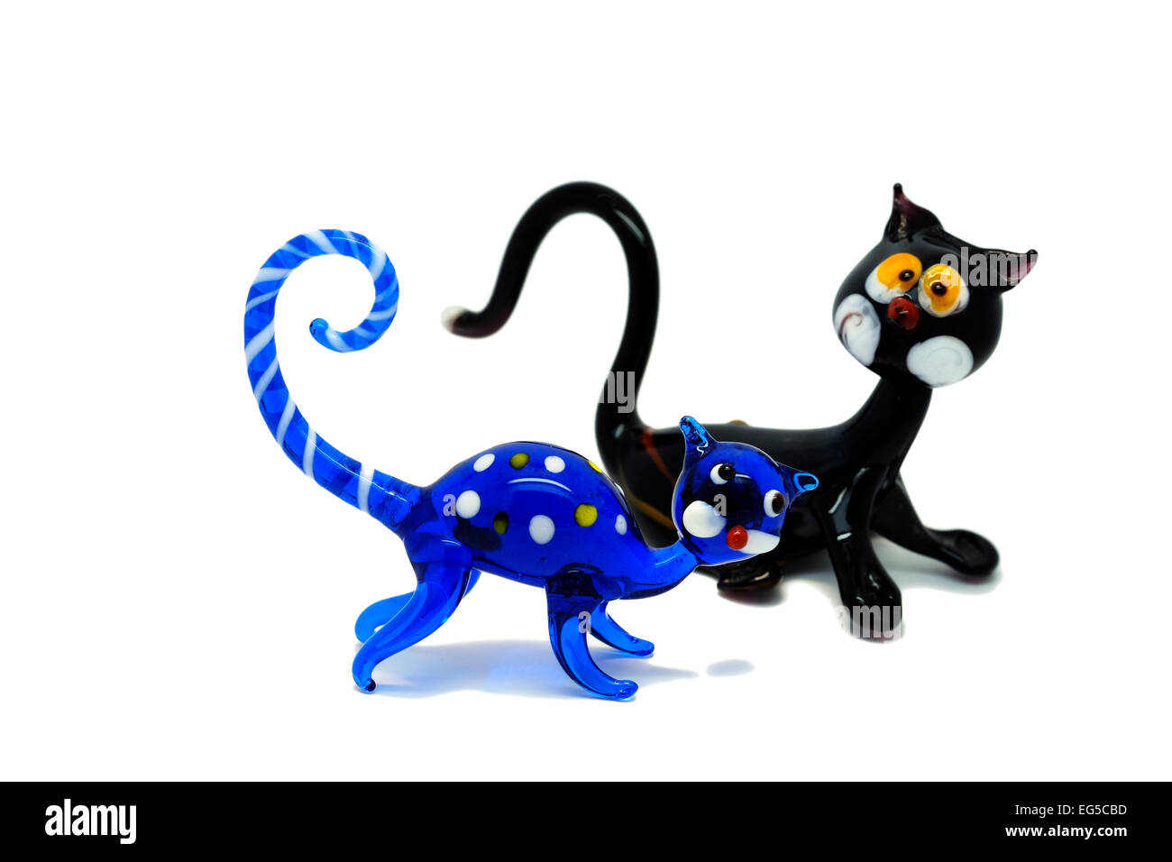 Two Murano Glass cat figurines blue and black as a cut-out Stock Photo
