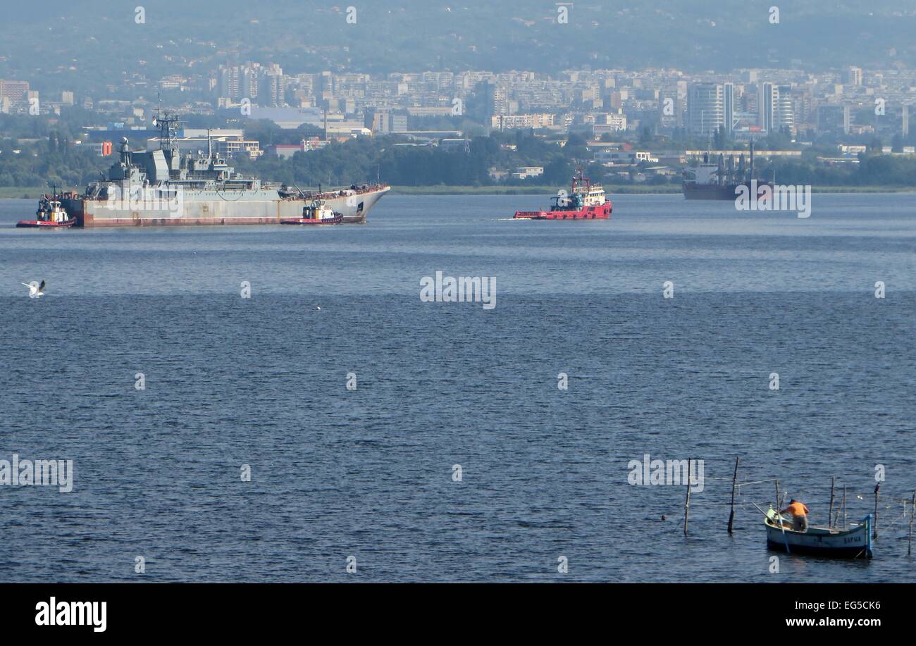 The Russian landing ship Caesar Kunikov is supported by tug boats as it floats in the Black Sea. The ship was in Bulgaria for planned repair works at the Flotski Arsenal shipyard in Varna, and the repair was performed in settlement of Bulgaria's national Stock Photo