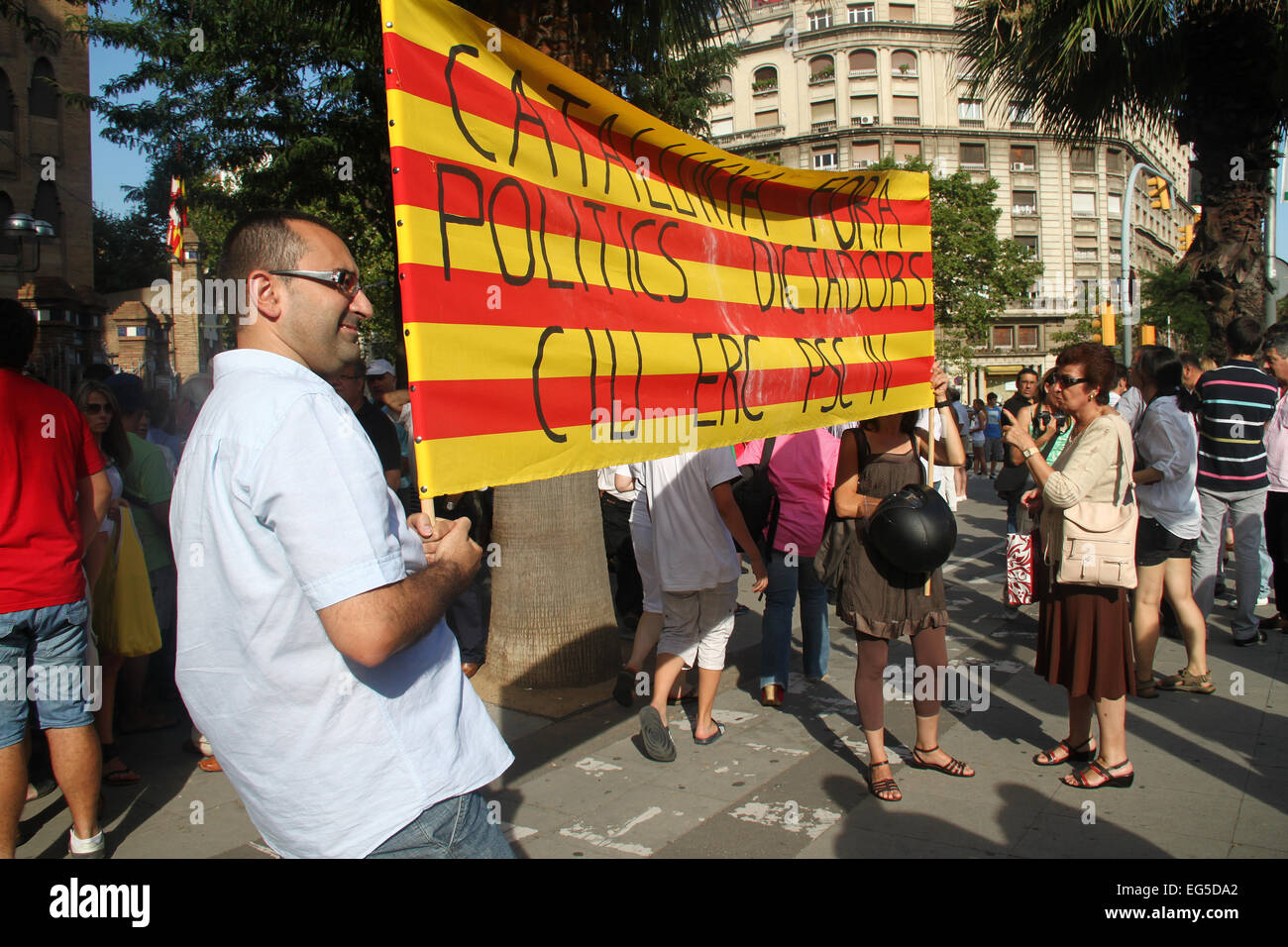 Pro bullfighting protesters with flag outside Monumental Bullring (plaza de toros), Barcelona, Catalonia, Spain Stock Photo