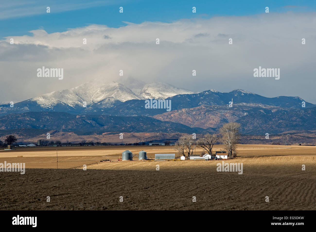 Greeley, Colorado - A farm below the snow-capped Rocky Mountains Stock ...