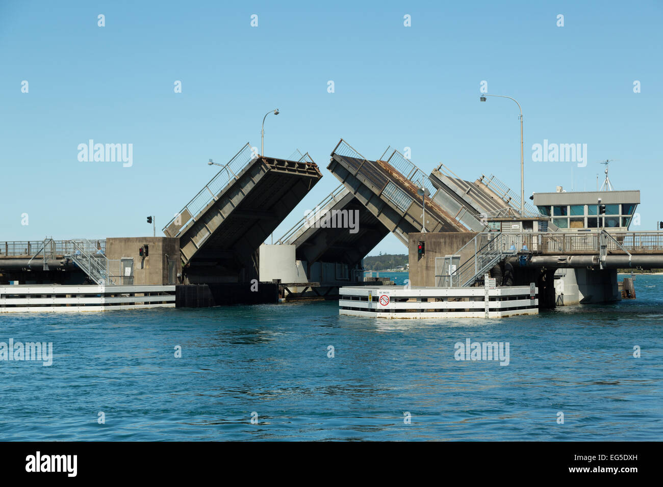 A photograph of the twin opening bridge at Swansea, Newcastle, Australia. The bridges are in a half open position. Stock Photo