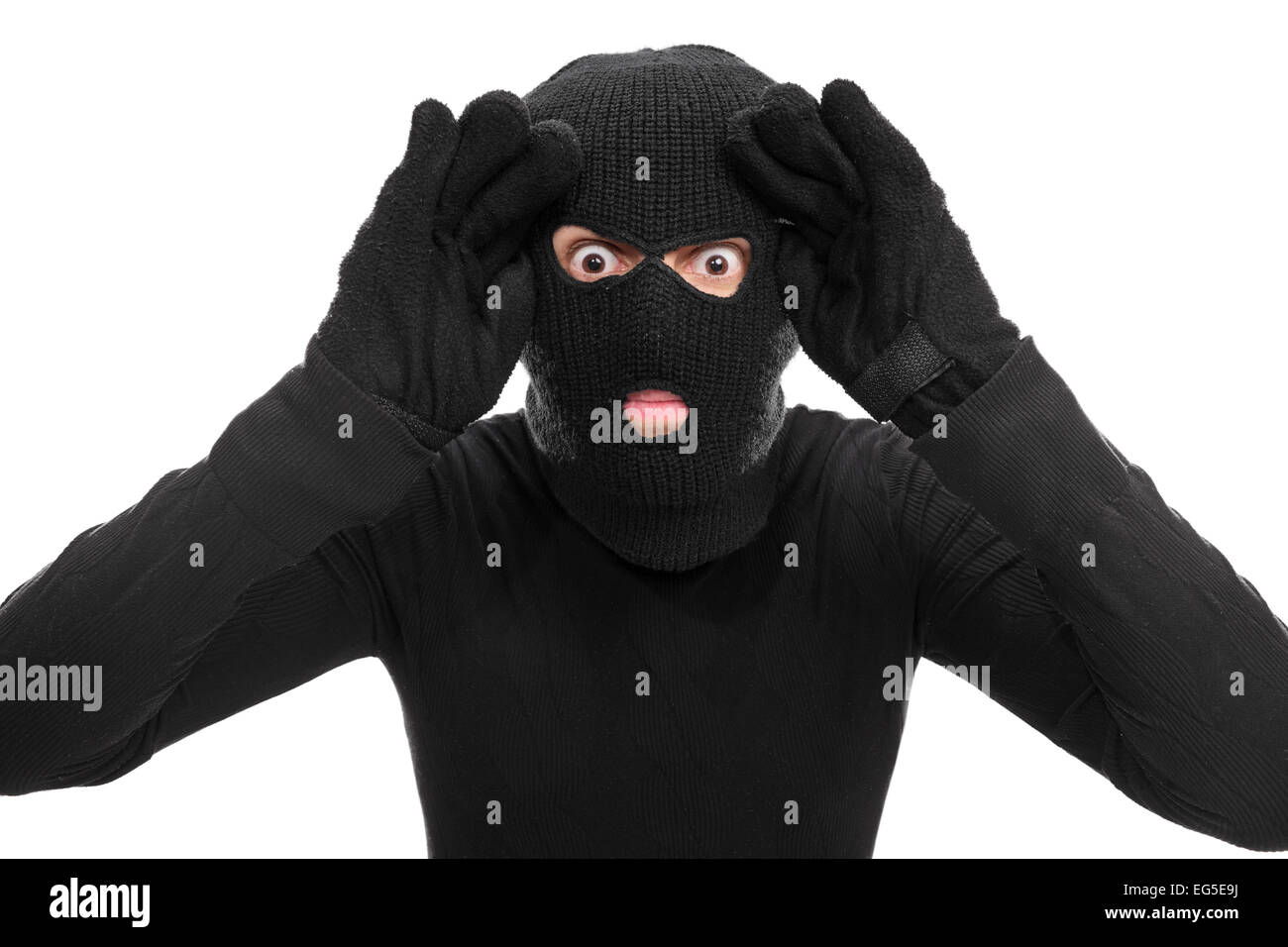 Male thief looking through an imaginary window isolated on white ...