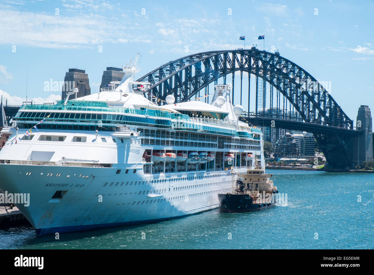 Rhapsody of the seas cruise liner in sydney's circular quay,alongside sydney harbour bridge,australia Stock Photo