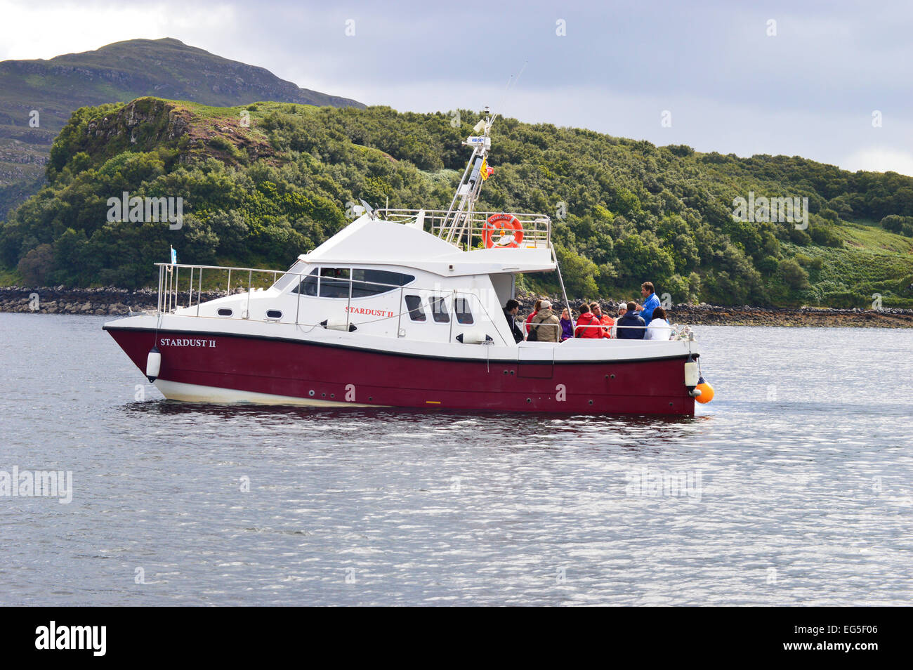 People enjoying a wildlife cruise from Portree, Isle of Skye. Stock Photo
