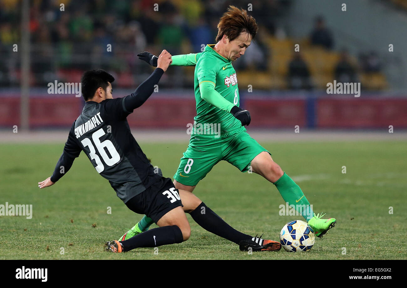 Beijing, China. 17th Feb, 2015. Piao Cheng (R) of China's Beijing Guoan