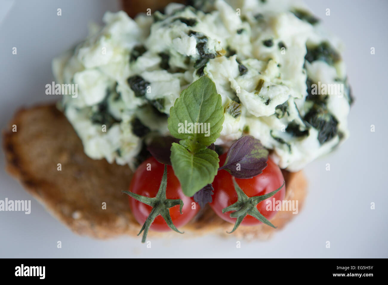 Scrambled Egg Whites With Spinach Cherry Tomatoes On A Slice Of Toasted Wholemeal Bread Stock Photo Alamy