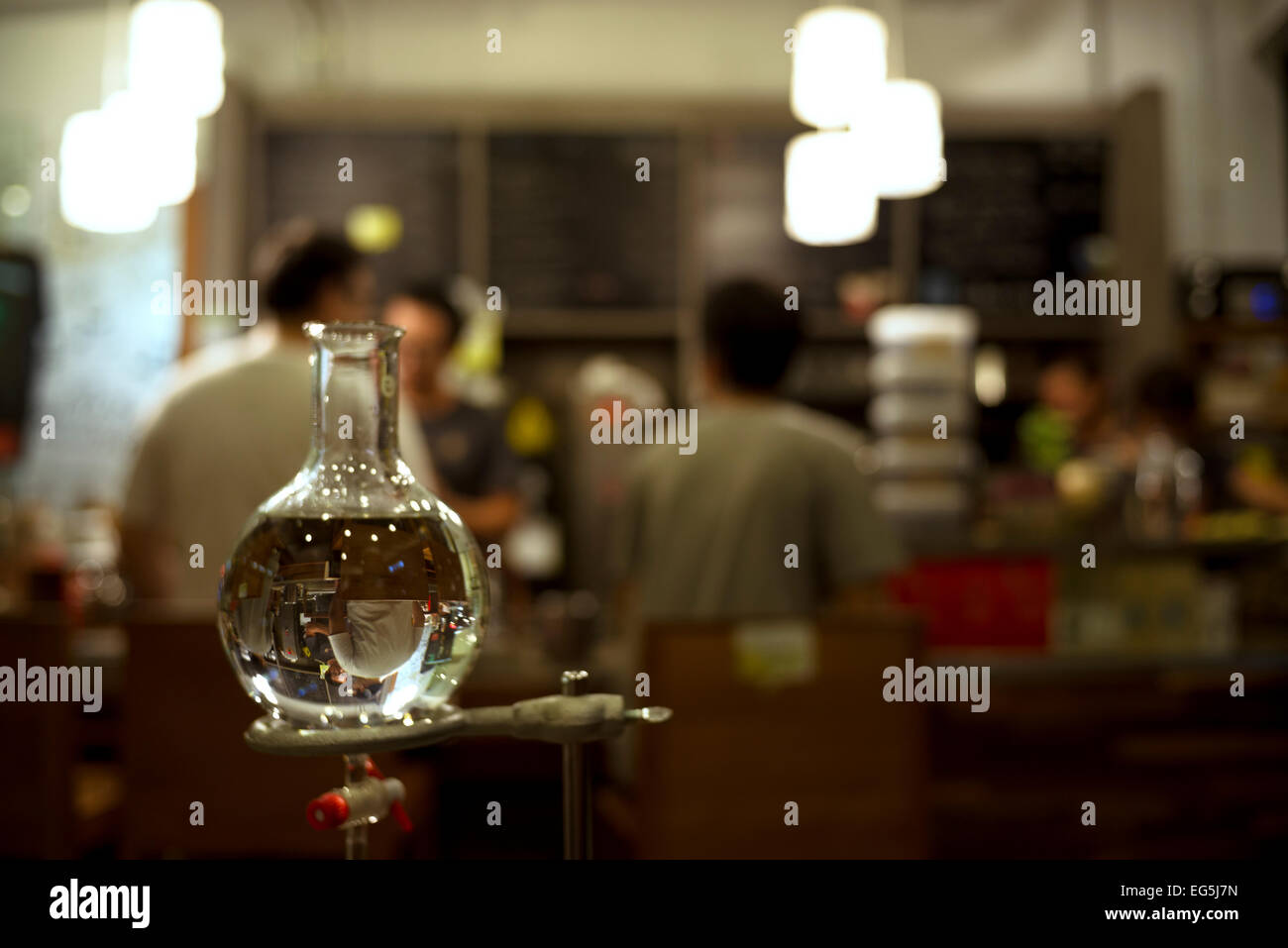 Flask of water with reverse reflection at Gallery Coffee Drip Stock Photo