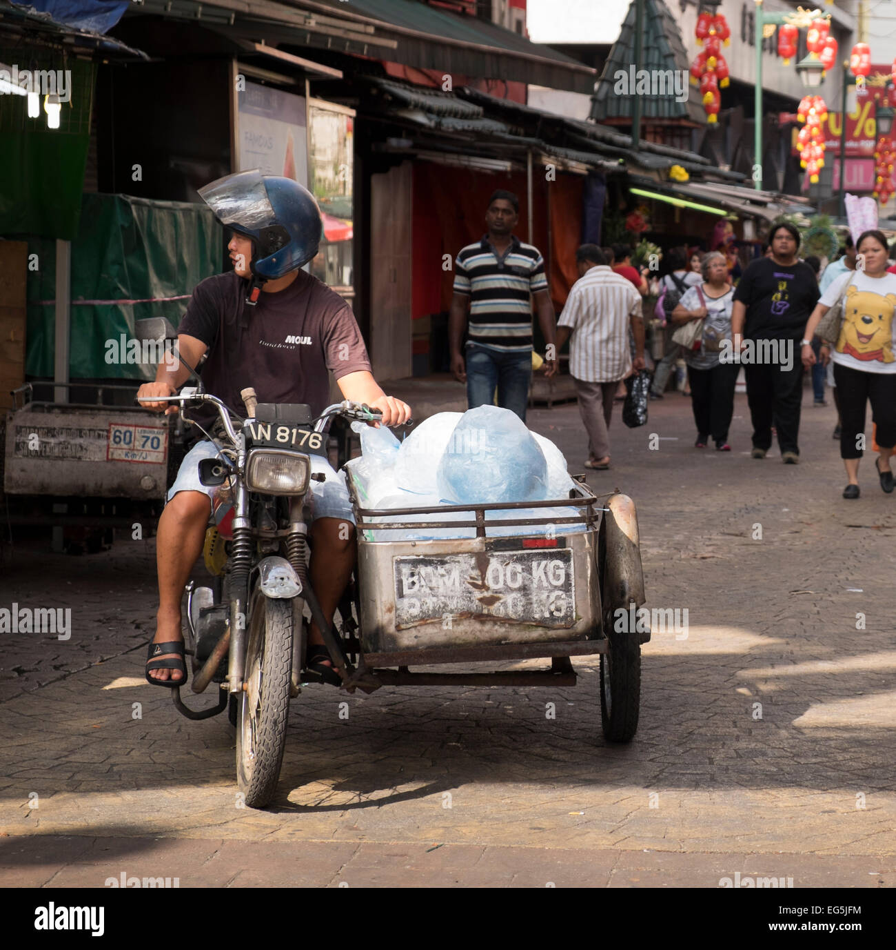 Ice seller on a Honda CG125 motorcycle with homemade sidecar, Chinatown, Kuala Lumpur, Malaysia. Stock Photo