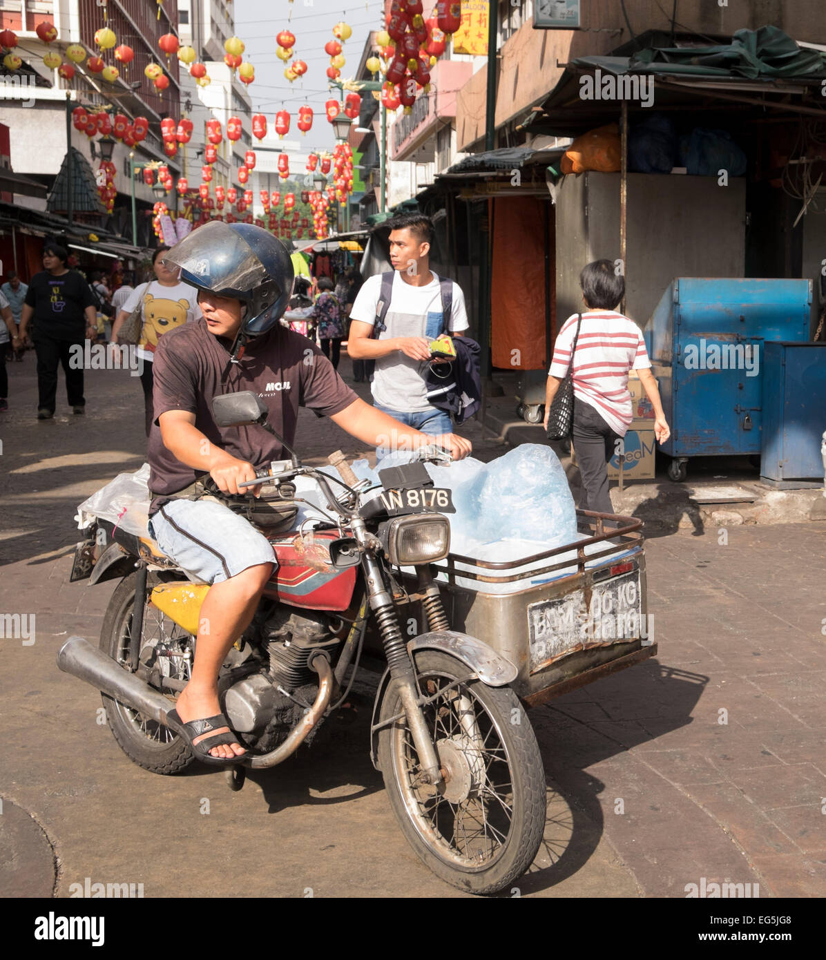 Ice seller on a Honda CG125 motorcycle with homemade sidecar, Chinatown, Kuala Lumpur, Malaysia. Stock Photo