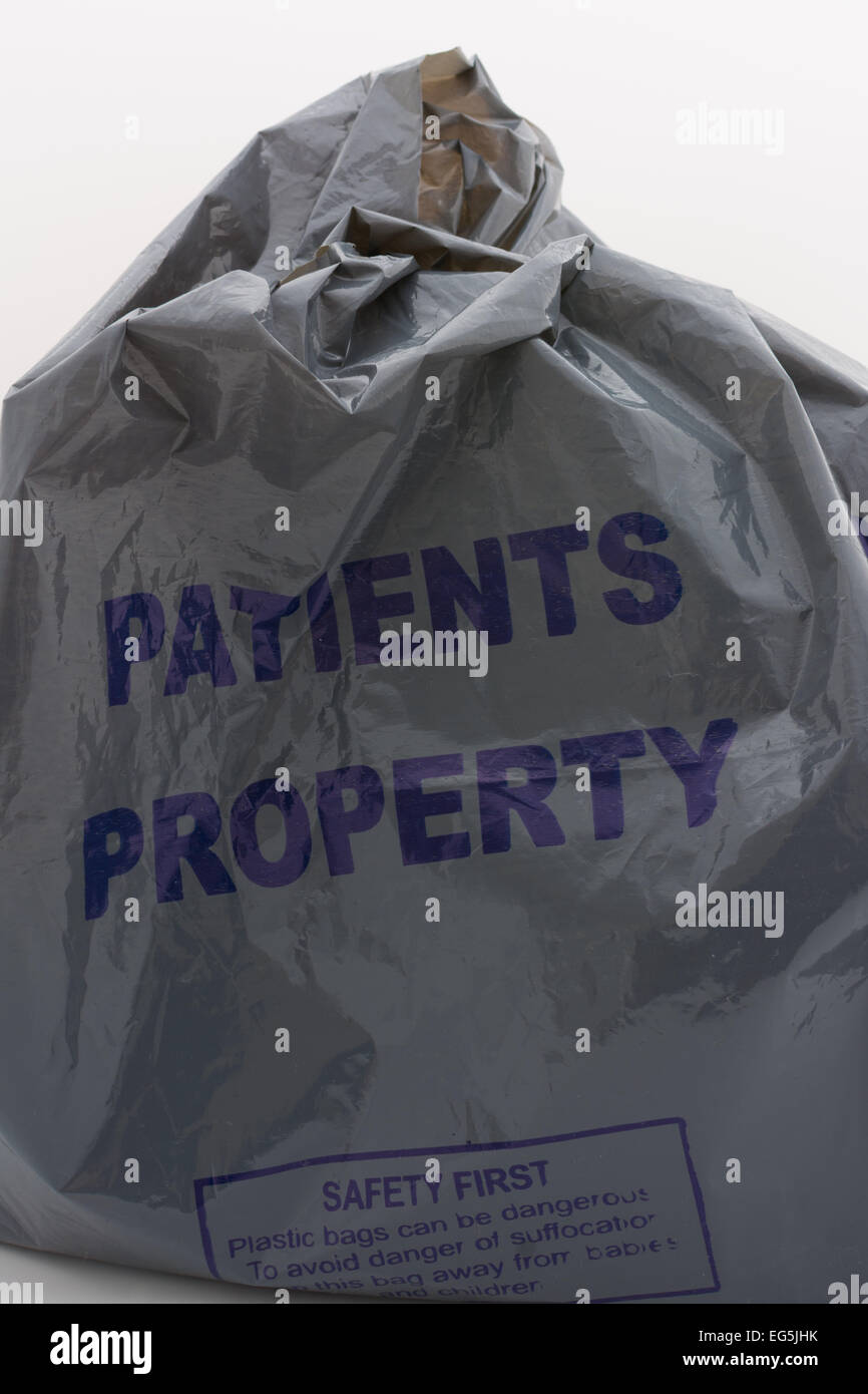 grey plastic bag labelled 'Patients Property' issued in UK NHS hospital Stock Photo