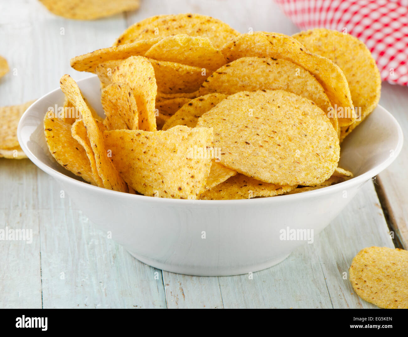 Corn nachos chips on a wooden table. Selective focus Stock Photo