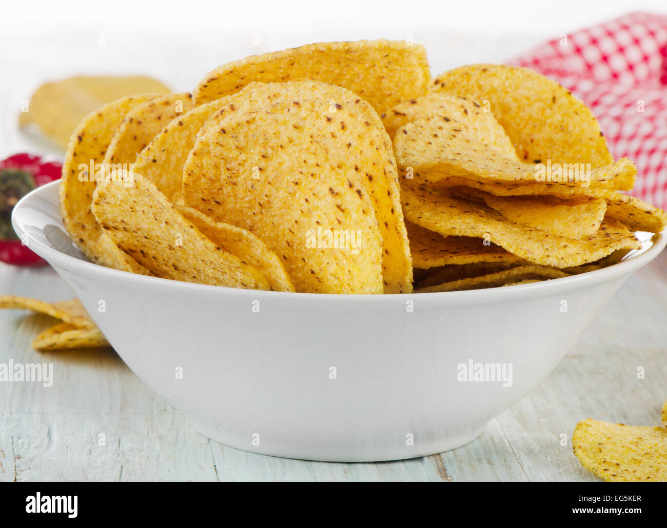 Corn nachos chips on  wooden table. Selective focus Stock Photo