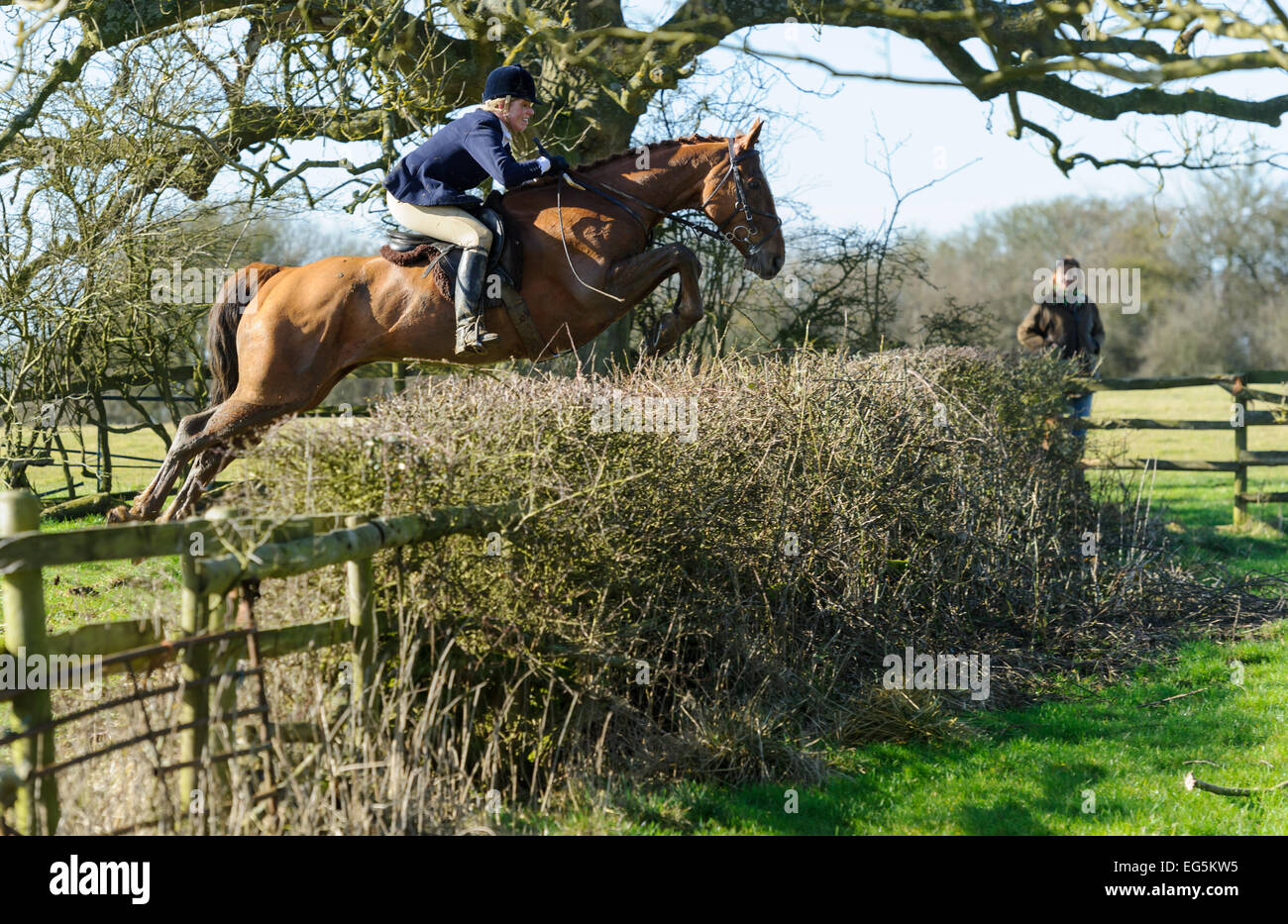 Oakham, UK. 17th February, 2015. Cottesmore Hunt meet. Hunts now follow trails which often involve crossing fences and hedges on land on which followers cannot normally ride. Credit:  Nico Morgan/Alamy Live News Stock Photo