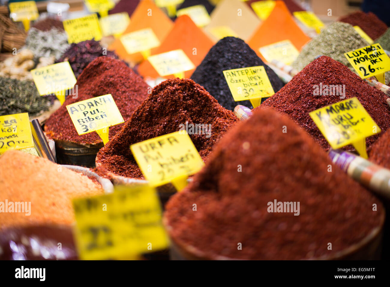 ISTANBUL, Turkey / Türkiye — A store selling mounds of spices in Istanbul's Spice Bazaar. Located in the Eminonu quarter of Istanbul, next to the Galata Bridge, the Spice Bazaar is one of the city's largest and most famous markets. It is also known as the Egyptian Bazaar. Stock Photo