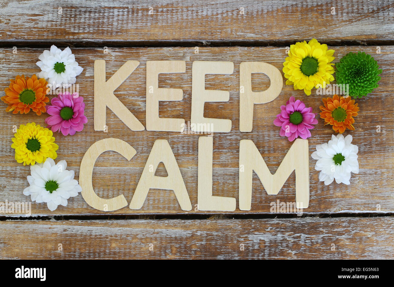 Keep calm written with wooden letters and Santini flowers Stock Photo