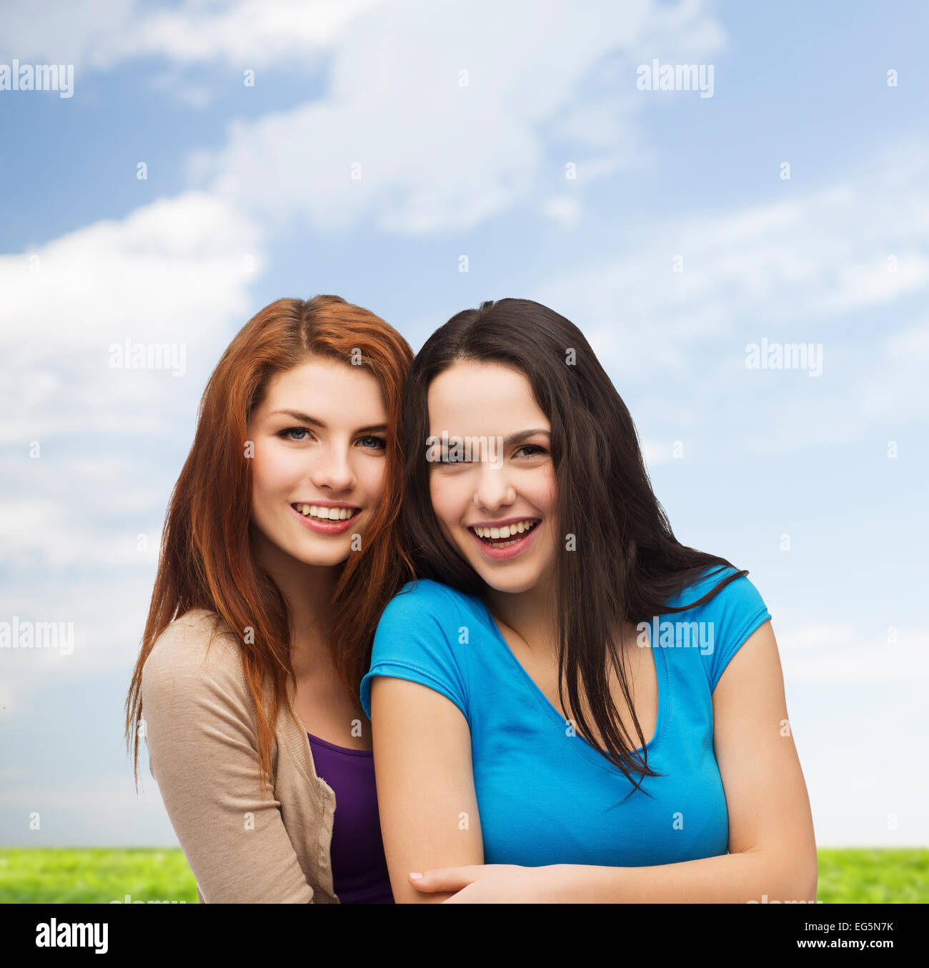 smiling teenage girls hugging Stock Photo - Alamy