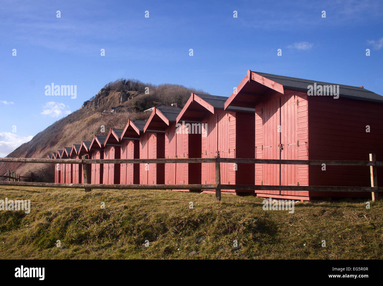 Beach huts beside the cliff at Branscombe, Devon Stock Photo