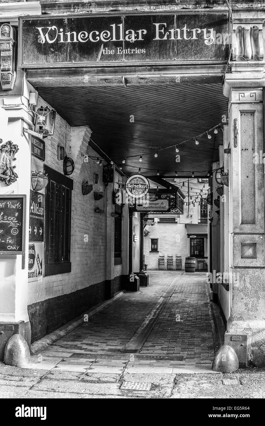 The front entrance of Winecellar Entry Belfast with no one walking through.  The photograph is rendered as a monochrome. Stock Photo