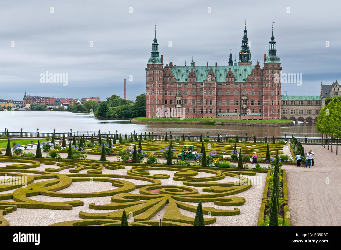 Tourists visiting the Frederiksborg palace and the baroque gardens in nasty weather. Stock Photo