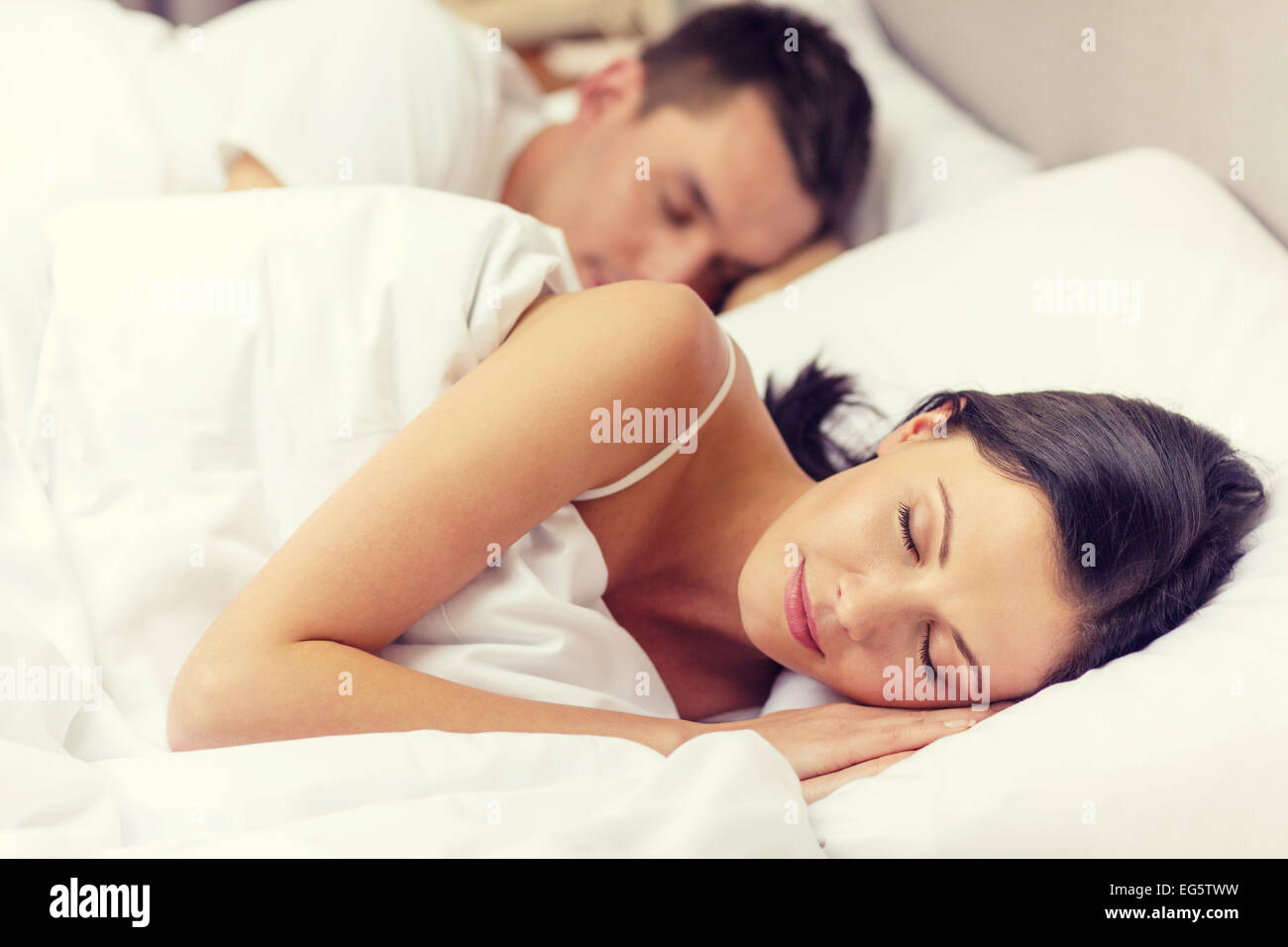 happy couple sleeping in bed Stock Photo - Alamy