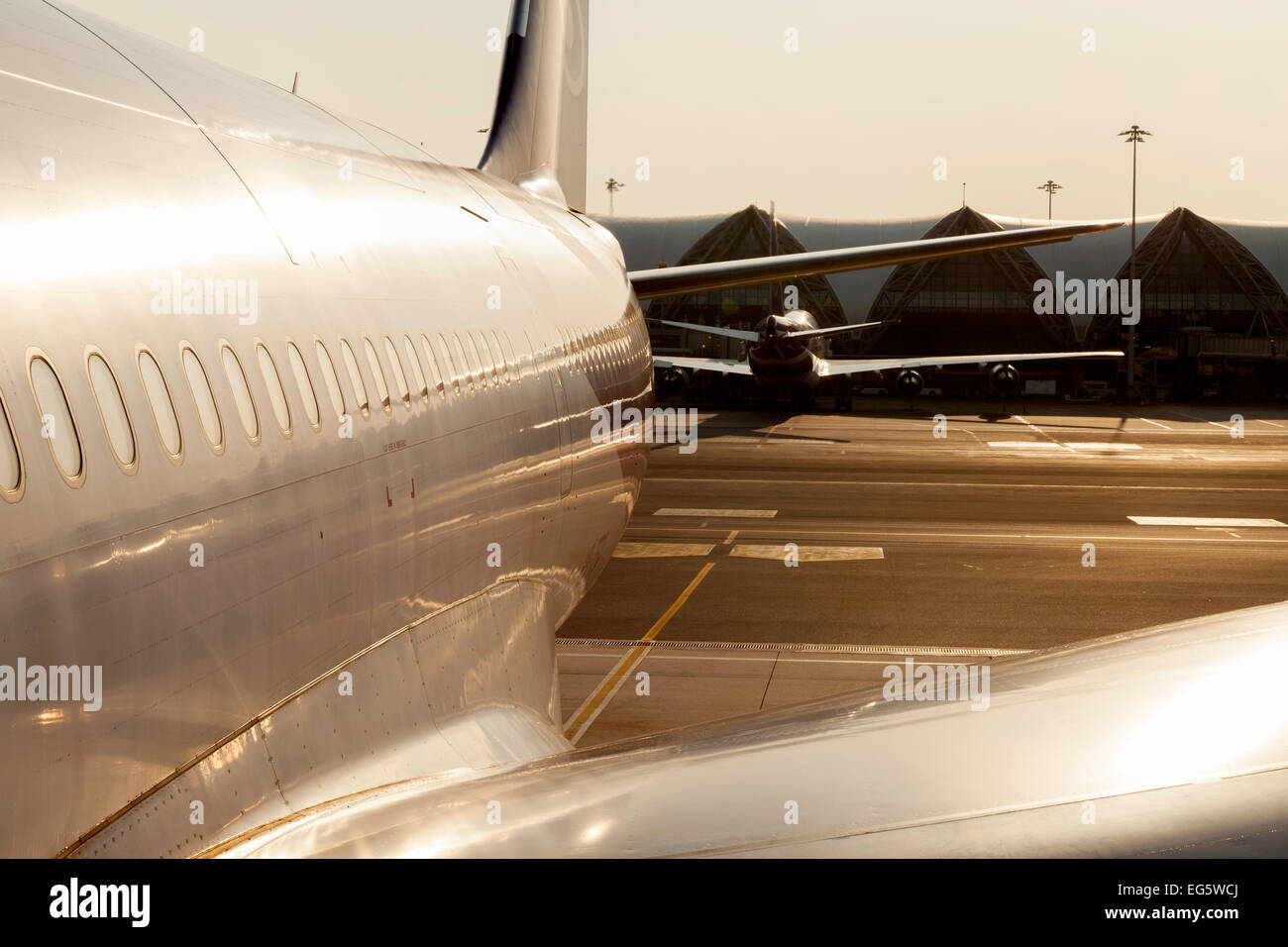 Airplane on the ground at Bangkok International Airport, Thailand, Asia - Concept of air travel Stock Photo