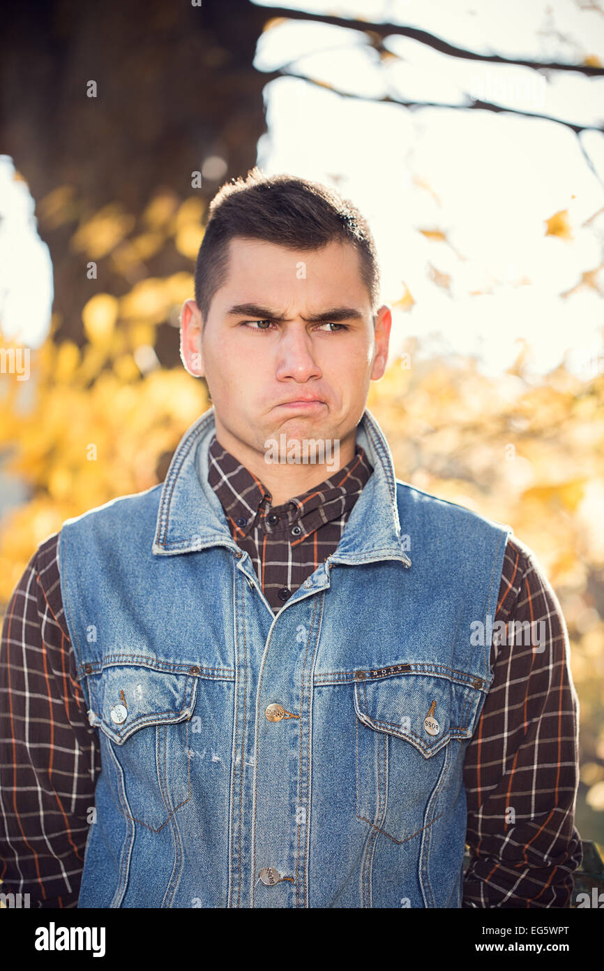 face man male young expression portrait grimace Stock Photo - Alamy