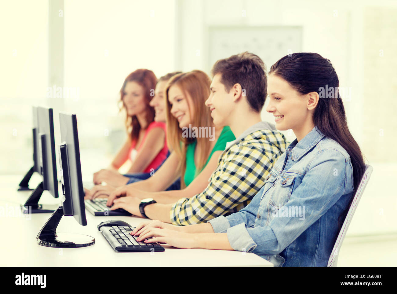female student with classmates in computer class Stock Photo - Alamy