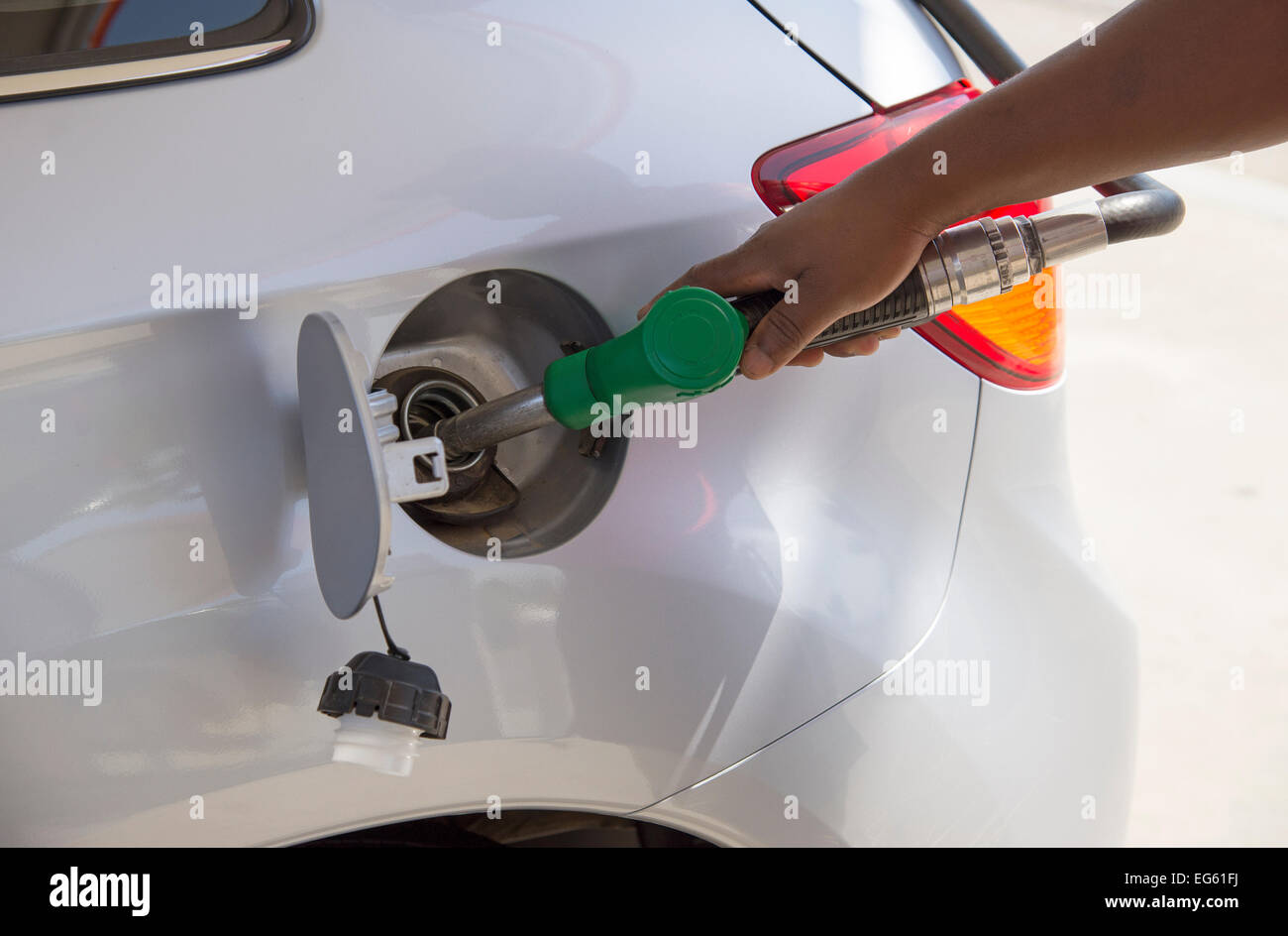 Filling vehicle fuel tank with petrol Stock Photo Alamy